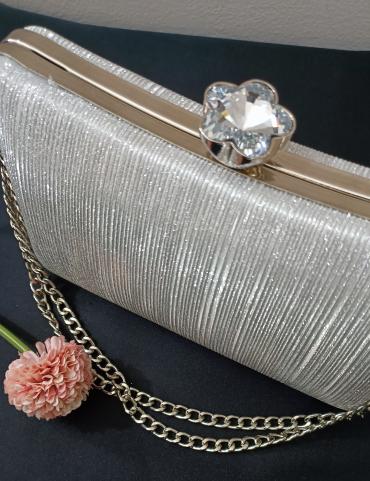 Shining silver clutch with chain handle