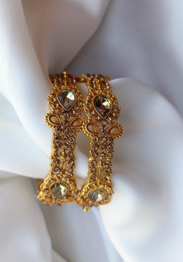 Indian golden kangan with champion stone