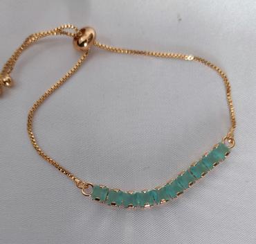 Gold plated bracelet with sea green diamonds
