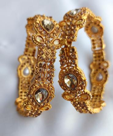 Indian golden kangan with champion stone