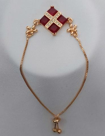 Gold plated red bracelet with silver pearls