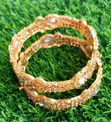 Indian golden kangan with champion stone